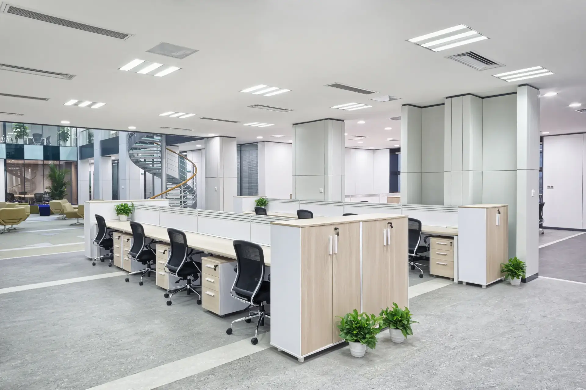 Modern open-plan office with workstations.