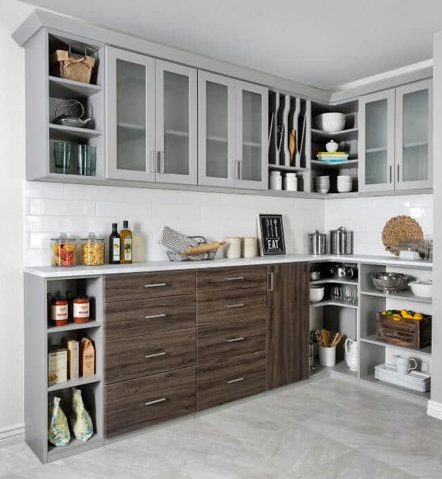 Modern kitchen with gray cabinets and shelves.