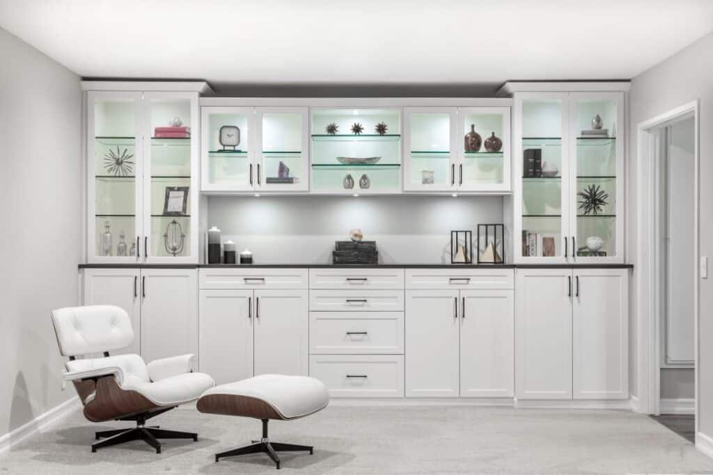Modern living room with white storage cabinets.
